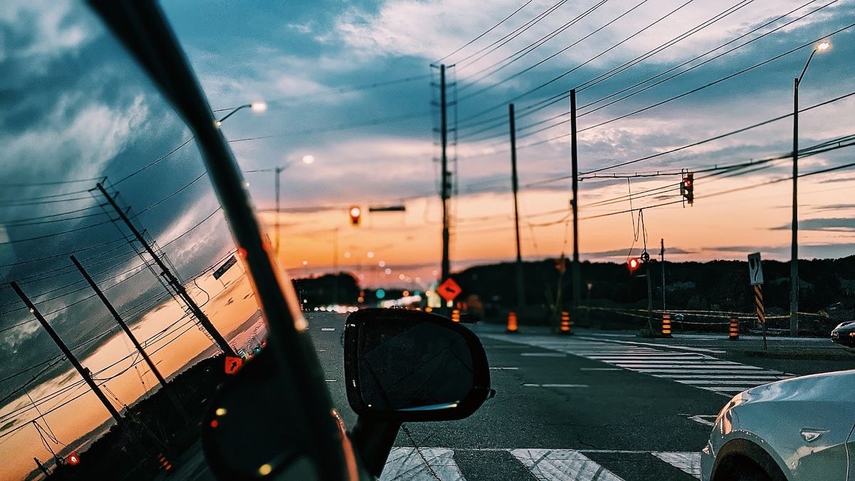 picture outside a car window, facing a highway